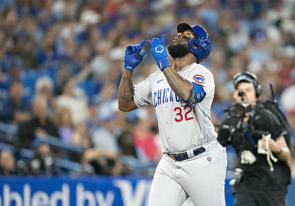 Aug 31, 2022; Toronto, Ontario, CAN; Chicago Cubs right fielder Franmil Reyes (32) celebrates hitting a home run against the Toronto Blue Jays during the fifth inning at Rogers Centre. Mandatory Credit: Nick Turchiaro-USA TODAY Sports