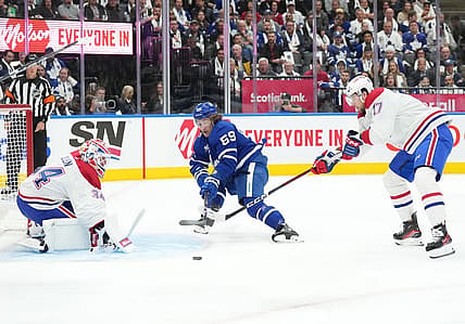 Oct 11, 2023; Toronto, Ontario, CAN; Toronto Maple Leafs left wing Tyler Bertuzzi (59) battles for the puck with Montreal Canadiens right wing Josh Anderson (17) in front of Montreal Canadiens goaltender Jake Allen (34) during the first period at Scotiabank Arena. Mandatory Credit: Nick Turchiaro-USA TODAY Sports