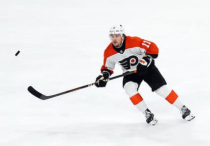 Dec 7, 2023; Tempe, Arizona, USA; Philadelphia Flyers right wing Travis Konecny (11) skates after a loose puck against the Arizona Coyotes during the third period at Mullett Arena. Mandatory Credit: Joe Camporeale-USA TODAY Sports