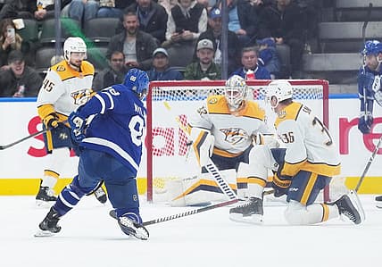 Dec 9, 2023; Toronto, Ontario, CAN; Toronto Maple Leafs right wing William Nylander (88) shoots the puck on Nashville Predators goaltender Kevin Lankinen (32) during the second period at Scotiabank Arena. Mandatory Credit: Nick Turchiaro-USA TODAY Sports