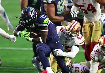 Jan 3, 2021; Glendale, Arizona, USA; Seattle Seahawks running back Alex Collins (41) is tackled by San Francisco 49ers linebacker Demetrius Flannigan-Fowles (45) at State Farm Stadium. Mandatory Credit: Mark J. Rebilas-USA TODAY Sports