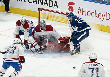 Feb 13, 2021; Toronto, Ontario, CAN; Toronto Maple Leafs center Travis Boyd (72) battles for a puck in front of Montreal Canadiens goaltender Carey Price (31) during the second period at Scotiabank Arena. Mandatory Credit: Nick Turchiaro-USA TODAY Sports