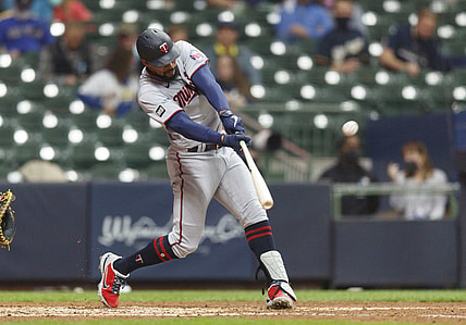 Apr 3, 2021; Milwaukee, Wisconsin, USA;  Minnesota Twins center fielder Byron Buxton (25) hits a home run against the Milwaukee Brewers during the seventh inning at American Family Field. Mandatory Credit: Jeff Hanisch-USA TODAY Sports