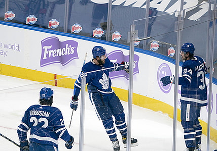 Apr 10, 2021; Toronto, Ontario, CAN; Toronto Maple Leafs center Auston Matthews (34) celebrates with center Alex Galchenyuk (12) after scoring a third goal against the Ottawa Senators during the second period at Scotiabank Arena. Mandatory Credit: Nick Turchiaro-USA TODAY Sports
