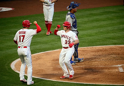 Jun 8, 2021; Anaheim, California, USA; Los Angeles Angels catcher Max Stassi (33) is greeted by designated hitter Shohei Ohtani (17) after hitting a two run home run against the Kansas City Royals during the third inning at Angel Stadium. Mandatory Credit: Gary A. Vasquez-USA TODAY Sports