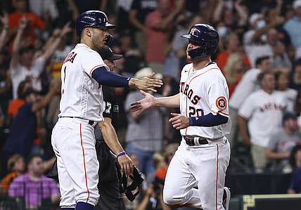 Aug 10, 2021; Houston, Texas, USA; Houston Astros center fielder Chas McCormick (20) celebrates with shortstop Carlos Correa (1) after scoring a run against the Colorado Rockies during the fourth inning at Minute Maid Park. Mandatory Credit: Troy Taormina-USA TODAY Sports