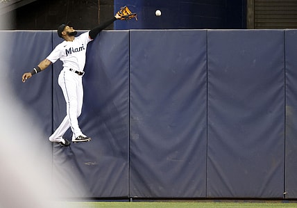 Miami Marlins center fielder Bryan De La Cruz can't catch a home run by Washington Nationals left fielder Yadiel Hernandez during the second inning at loanDepot Park.