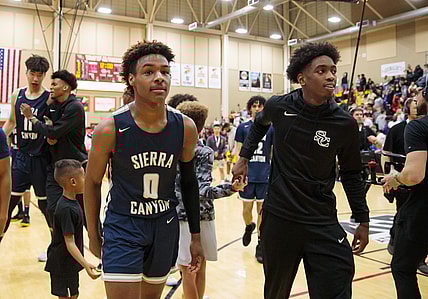 Dec 7, 2019; Scottsdale, AZ, USA; Sierra Canyon School guard LeBron James Jr (0) and teammate Zaire Wade against Millennium High School during the 2019 Hoophall West basketball tournament at Chaparral High School. Mandatory Credit: Mark J. Rebilas-USA TODAY Sports