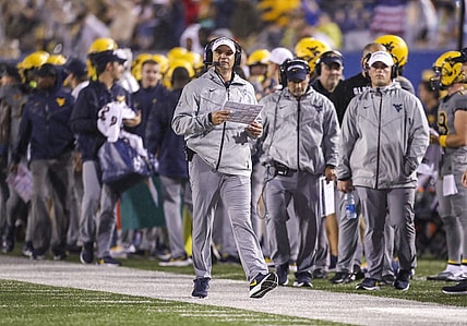 Sep 9, 2023; Morgantown, West Virginia, USA; West Virginia Mountaineers head coach Neal Brown walks long the sidelines during the second quarter against the Duquesne Dukes at Mountaineer Field at Milan Puskar Stadium. Mandatory Credit: Ben Queen-USA TODAY Sports