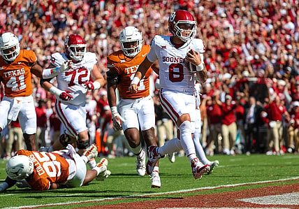 Oct 7, 2023; Dallas, Texas, USA;  Oklahoma Sooners quarterback Dillon Gabriel (8) runs for a touchdown during the first half against the Texas Longhorns at the Cotton Bowl. Mandatory Credit: Kevin Jairaj-USA TODAY Sports