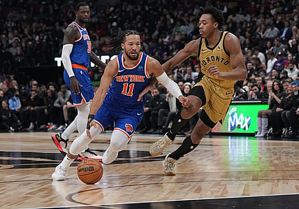 Dec 1, 2023; Toronto, Ontario, CAN; New York Knicks guard Jalen Brunson (11) controls the ball as Toronto Raptors forward Scottie Barnes (4) tries to defend during the first quarter at Scotiabank Arena. Mandatory Credit: Nick Turchiaro-USA TODAY Sports
