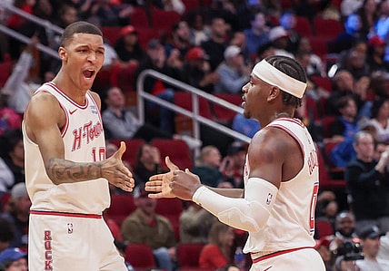 Dec 6, 2023; Houston, Texas, USA;  Houston Rockets forward Jabari Smith Jr. (10) reacts a basket by guard Aaron Holiday (0) against the Oklahoma City Thunder in the second half at Toyota Center. Mandatory Credit: Thomas Shea-USA TODAY Sports