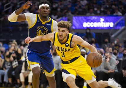 Jan 20, 2022; San Francisco, California, USA; Indiana Pacers guard Chris Duarte (3) drives around Golden State Warriors forward Kevon Looney (5) during the second quarter at Chase Center. Mandatory Credit: D. Ross Cameron-USA TODAY Sports