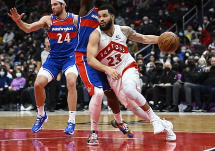 Jan 21, 2022; Washington, District of Columbia, USA; Toronto Raptors guard Fred VanVleet (23) drives past Washington Wizards center Montrezl Harrell (6) and forward Corey Kispert (24) during the first half at Capital One Arena. Mandatory Credit: Brad Mills-USA TODAY Sports