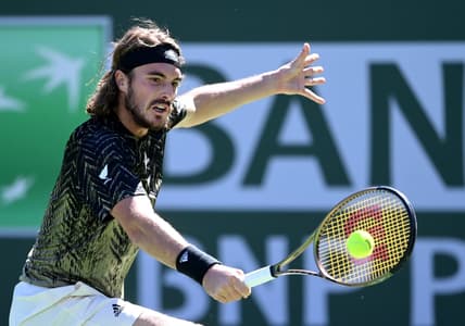 Oct 15, 2021; Indian Wells, CA, USA;   Stefanos Tsitsipas (GRE)hits a shot during his quarter final match against Nikoloz Basilashvili (GEO) during the BNP Paribas Open at the Indian Wells Tennis Garden. Mandatory Credit: Jayne Kamin-Oncea-USA TODAY Sports