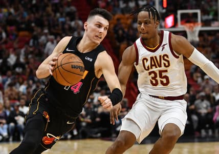 Mar 11, 2022; Miami, Florida, USA; Cleveland Cavaliers forward Isaac Okoro (35) defends Miami Heat guard Tyler Herro (14) during the first half at FTX Arena. Mandatory Credit: Jim Rassol-USA TODAY Sports