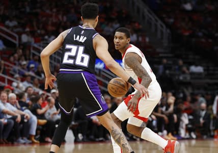 Mar 30, 2022; Houston, Texas, USA; Houston Rockets guard Kevin Porter Jr. (3) dribbles the ball as Sacramento Kings guard Jeremy Lamb (26) defends during the second quarter at Toyota Center. Mandatory Credit: Troy Taormina-USA TODAY Sports