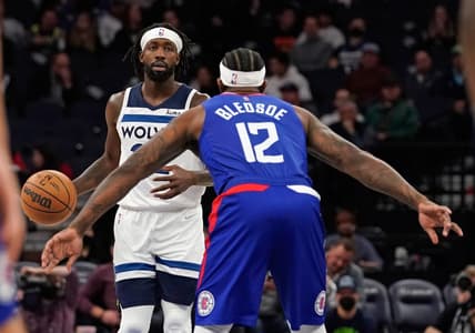 Nov 3, 2021; Minneapolis, Minnesota, USA;  Minnesota Timberwolves guard Patrick Beverly (22) controls the ball as Los Angeles Clippers guard Eric Bledsoe (12) defends at Target Center. Mandatory Credit: Nick Wosika-USA TODAY Sports