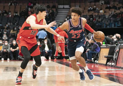 Dec 28, 2021; Toronto, Ontario, CAN; Philadelphia 76ers guard Matisse Thybulle (22) controls the ball as Toronto Raptors forward Yuta Watanabe (18) tries to defend during the first quarter at Scotiabank Arena. Mandatory Credit: Nick Turchiaro-USA TODAY Sports