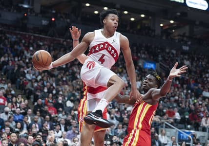 Apr 5, 2022; Toronto, Ontario, CAN; Toronto Raptors forward Scottie Barnes (4) controls the ball as Atlanta Hawks center Clint Capela (15) tries to defend during the fourth quarter at Scotiabank Arena. Mandatory Credit: Nick Turchiaro-USA TODAY Sports