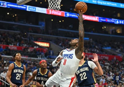 Oct 30, 2022; Los Angeles, California, USA;  Los Angeles Clippers guard John Wall (11) drives past New Orleans Pelicans forward Larry Nance Jr. (22) for a basket in the second half at Crypto.com Arena. Mandatory Credit: Jayne Kamin-Oncea-USA TODAY Sports