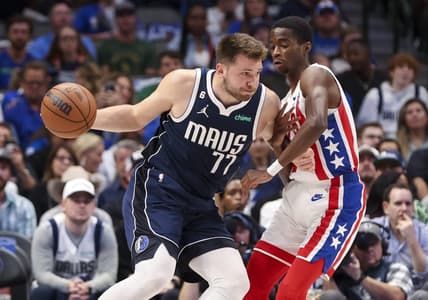 Nov 7, 2022; Dallas, Texas, USA;  Dallas Mavericks guard Luka Doncic (77) looks to shoot as Brooklyn Nets guard Edmond Sumner (4) defends during the first quarter at American Airlines Center. Mandatory Credit: Kevin Jairaj-USA TODAY Sports