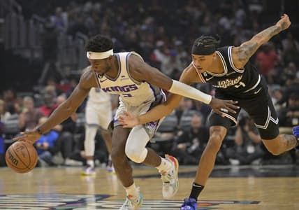 Dec 3, 2022; Los Angeles, California, USA;  Sacramento Kings guard Terence Davis (3) and Los Angeles Clippers guard Brandon Boston Jr. (4) chase down a loose ball in the first half at Crypto.com Arena. Mandatory Credit: Jayne Kamin-Oncea-USA TODAY Sports