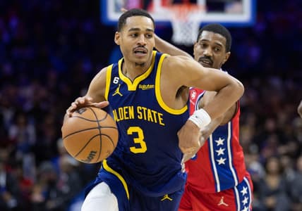 Dec 16, 2022; Philadelphia, Pennsylvania, USA; Golden State Warriors guard Jordan Poole (3) drives past Philadelphia 76ers guard De'Anthony Melton (8) during the second quarter at Wells Fargo Center. Mandatory Credit: Bill Streicher-USA TODAY Sports