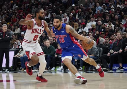 Dec 30, 2022; Chicago, Illinois, USA; Chicago Bulls guard Coby White (0) defends Detroit Pistons center Isaiah Stewart (28) during the first quarter at United Center. Mandatory Credit: David Banks-USA TODAY Sports