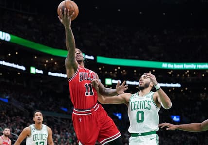 Jan 9, 2023; Boston, Massachusetts, USA; Chicago Bulls forward DeMar DeRozan (11) drives to the basket against Boston Celtics forward Jayson Tatum (0) in the first quarter at TD Garden. Mandatory Credit: David Butler II-USA TODAY Sports