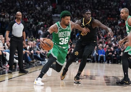 Jan 21, 2023; Toronto, Ontario, CAN; Boston Celtics guard Marcus Smart (36) controls the ball as Toronto Raptors forward Pascal Siakam (43) defends during the second quarter at Scotiabank Arena. Mandatory Credit: Nick Turchiaro-USA TODAY Sports