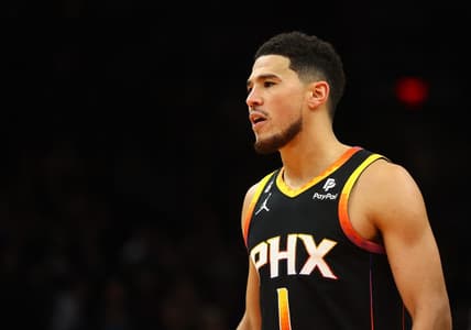 Dec 17, 2022; Phoenix, Arizona, USA; Phoenix Suns guard Devin Booker (1) against the New Orleans Pelicans in the second half at Footprint Center. Mandatory Credit: Mark J. Rebilas-USA TODAY Sports
