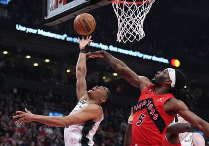 Feb 8, 2023; Toronto, Ontario, CAN; San Antonio Spurs forward Keldon Johnson (3) drives to the basket as Toronto Raptors forward Precious Achiuwa (5) tries to defend during the first quarter at Scotiabank Arena. Mandatory Credit: Nick Turchiaro-USA TODAY Sports