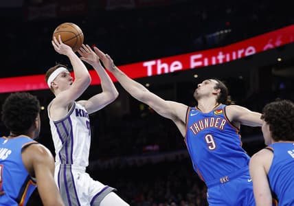 Feb 26, 2023; Oklahoma City, Oklahoma, USA; Oklahoma City Thunder forward Dario Saric (9) defends a shot by Sacramento Kings guard Kevin Huerter (9) during the second quarter at Paycom Center. Mandatory Credit: Alonzo Adams-USA TODAY Sports