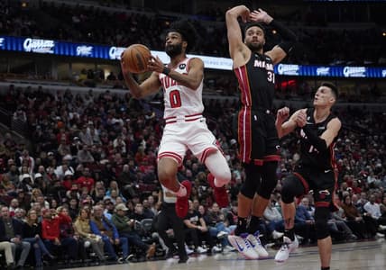 Mar 18, 2023; Chicago, Illinois, USA; Miami Heat guard Max Strus (31) defends Chicago Bulls guard Coby White (0) during the first half at United Center. Mandatory Credit: David Banks-USA TODAY Sports