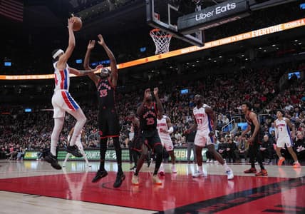 Mar 24, 2023; Toronto, Ontario, CAN; Detroit Pistons guard R.J. Hampton (14) drives to the basket as Toronto Raptors center Christian Koloko (35) tries to defend during the second quarter at Scotiabank Arena. Mandatory Credit: Nick Turchiaro-USA TODAY Sports