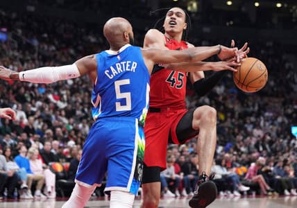 Apr 9, 2023; Toronto, Ontario, CAN;Toronto Raptors guard Dalano Banton (45) controls the ball as Milwaukee Bucks guard Jevon Carter (5) tries to defend during the second quarter at Scotiabank Arena. Mandatory Credit: Nick Turchiaro-USA TODAY Sports