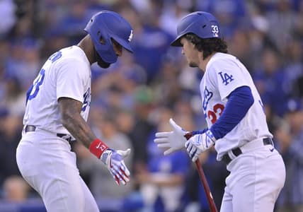 May 30, 2023; Los Angeles, California, USA; Los Angeles Dodgers right fielder Jason Heyward (23) celebrates with center fielder James Outman (33) after hitting a solo home run in the second inning against the Washington Nationals at Dodger Stadium. Mandatory Credit: Jayne Kamin-Oncea-USA TODAY Sports