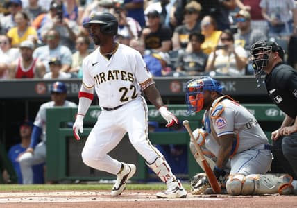 Jun 11, 2023; Pittsburgh, Pennsylvania, USA; Pittsburgh Pirates designated hitter Andrew McCutchen (22) hits a single to register his 2000th career major league hit during the first inning against the New York Mets at PNC Park. Mandatory Credit: Charles LeClaire-USA TODAY Sports