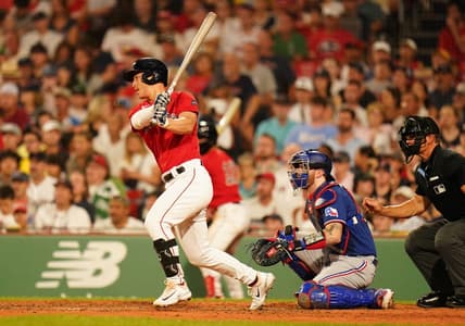 Jul 6, 2023; Boston, Massachusetts, USA; Boston Red Sox left fielder Rob Refsnyder (30) hits a single to center field to drive in a run against the Texas Rangers in the sixth inning at Fenway Park. Mandatory Credit: David Butler II-USA TODAY Sports