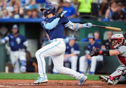 Jul 28, 2023; Kansas City, Missouri, USA; Kansas City Royals shortstop Bobby Witt Jr. (7) hits a single against the Minnesota Twins during the first inning at Kauffman Stadium. Mandatory Credit: Jay Biggerstaff-USA TODAY Sports