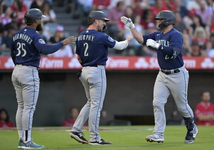Aug 4, 2023; Anaheim, California, USA;  Seattle Mariners first baseman Ty France (23) is greeted by right fielder Teoscar Hernandez (35) and catcher Tom Murphy (2) after hitting a three run home run in the first inning against the Los Angeles Angels at Angel Stadium. Mandatory Credit: Jayne Kamin-Oncea-USA TODAY Sports