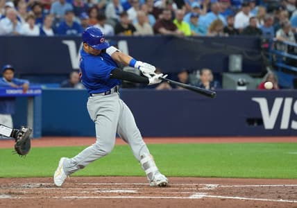Aug 11, 2023; Toronto, Ontario, CAN; Chicago Cubs right fielder Seiya Suzuki (27) hits a two RBI double against the Toronto Blue Jays during the fourth inning at Rogers Centre. Mandatory Credit: Nick Turchiaro-USA TODAY Sports