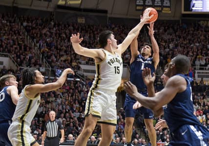 Nov 13, 2023; West Lafayette, Indiana, USA; Purdue Boilermakers center Zach Edey (15) blocks a shot by Xavier Musketeers guard Desmond Claude (1) during the first half at Mackey Arena. Mandatory Credit: Marc Lebryk-USA TODAY Sports