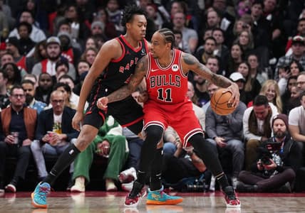 Jan 18, 2024; Toronto, Ontario, CAN; Chicago Bulls forward DeMar DeRozan (11) controls the ball as Toronto Raptors forward Scottie Barnes (4) tries to defend during the second quarter at Scotiabank Arena. Mandatory Credit: Nick Turchiaro-USA TODAY Sports