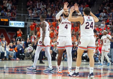 Auburn Tigers forward Johni Broome (4) and Auburn Tigers guard Lior Berman (24) celebrate Berman   s three-pointer as Auburn Tigers takes on Ole Miss Rebels at Neville Arena in Auburn, Ala., on Saturday, Jan. 20, 2024. Auburn Tigers lead Ole Miss Rebels 46-27 at halftime.