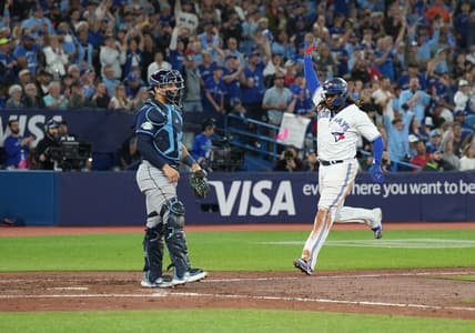 Sep 29, 2023; Toronto, Ontario, CAN; Toronto Blue Jays first baseman Vladimir Guerrero Jr. (27) runs to home plate scoring a run against the Tampa Bay Rays during the sixth inning at Rogers Centre. Mandatory Credit: Nick Turchiaro-USA TODAY Sports
