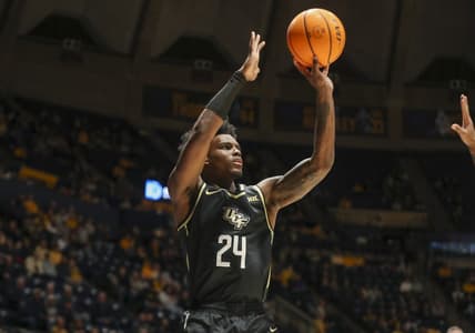 Feb 20, 2024; Morgantown, West Virginia, USA; UCF Knights guard Jaylin Sellers (24) shoots a three pointer during the first half against the West Virginia Mountaineers at WVU Coliseum. Mandatory Credit: Ben Queen-USA TODAY Sports