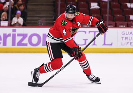 CHICAGO, IL - JANUARY 26: Seth Jones #4 of the Chicago Blackhawks controls the puck during the third period against the Minnesota Wild on January 26, 2025 at the United Center in Chicago, Illinois. (Photo by Melissa Tamez/Icon Sportswire)