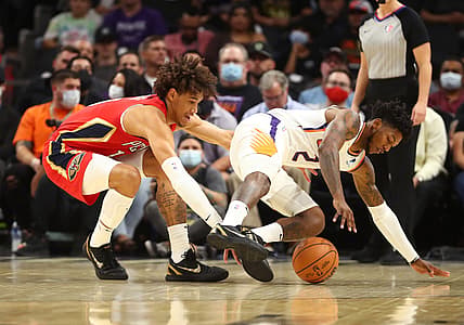Nov 2, 2021; Phoenix, Arizona, USA; Phoenix Suns guard Elfrid Payton (right) loses the ball against New Orleans Pelicans center Jaxson Hayes in the first half at Footprint Center. Mandatory Credit: Mark J. Rebilas-USA TODAY Sports